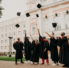 Graduates tossing caps